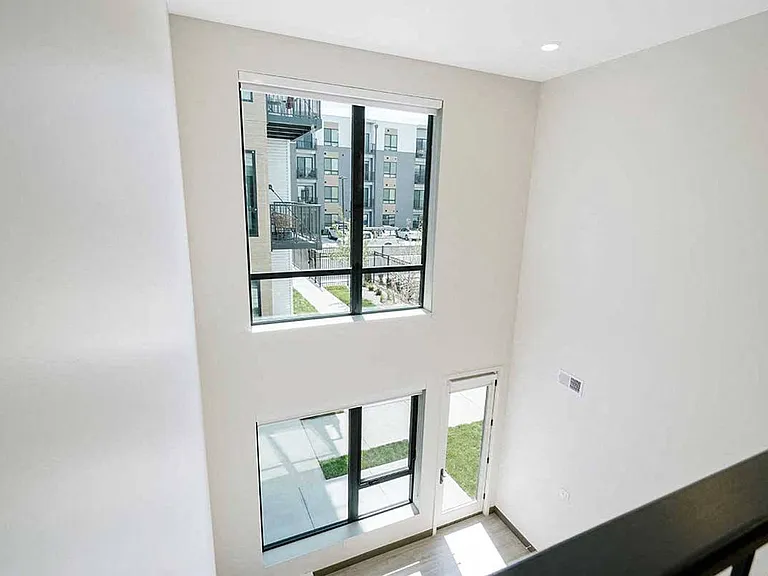 Two-story windows flood this stunning loft with light, making every day feel brighter!