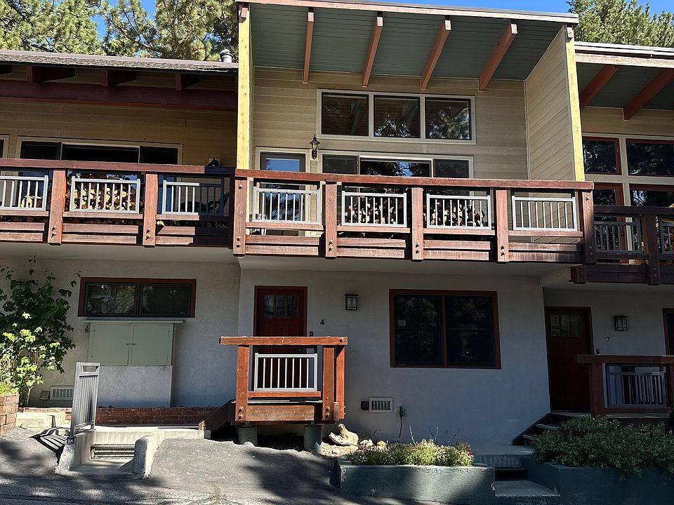Front view of condo, both lower entry level and upper level balcony and view windows facing the Sherwins Mtns