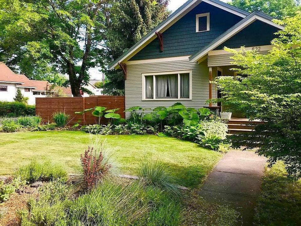 Front entrance on Foster Avenue. Within walking distance to Tubbs Hill, restaurants and shops downtown. A corner lot in a quiet neighborhood lined with large maple trees.