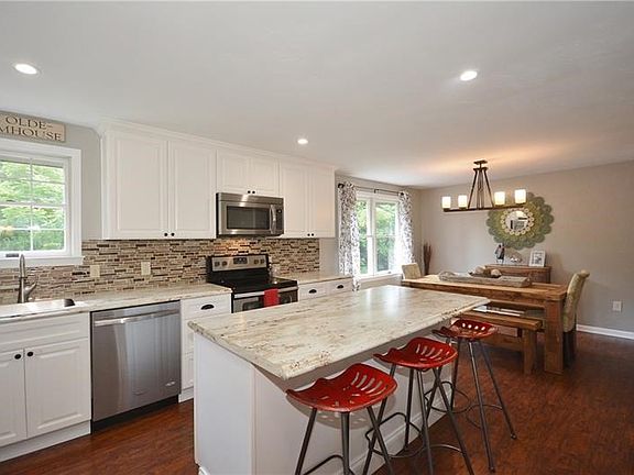 Beautiful updated kitchen. Eat at the large island, or in the open dining room!