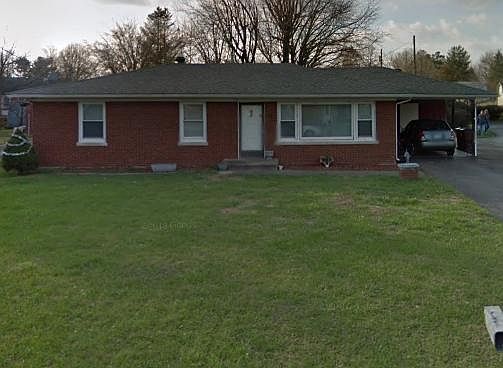 Front of house; covered carport