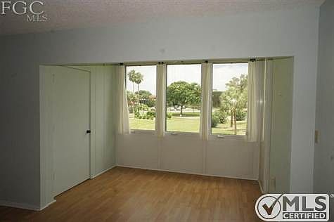 Wonderful Florida Room with landscaped view of the golf course.