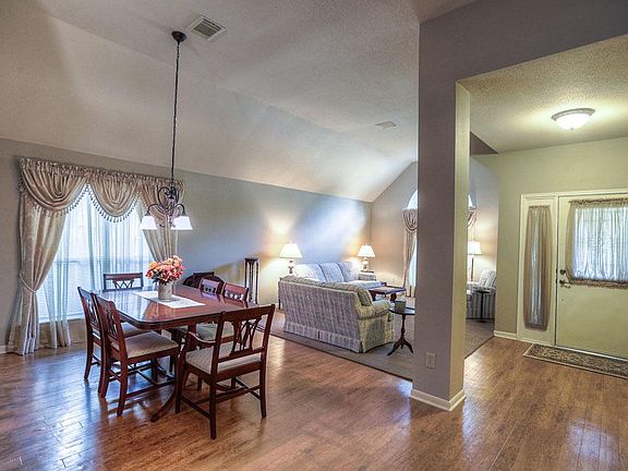 View of formal areas after entering the home showcases cathedral ceilings.