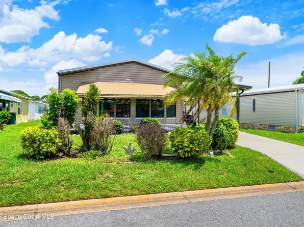 602 Dolphin Cir, Barefoot Bay, FL 32976
