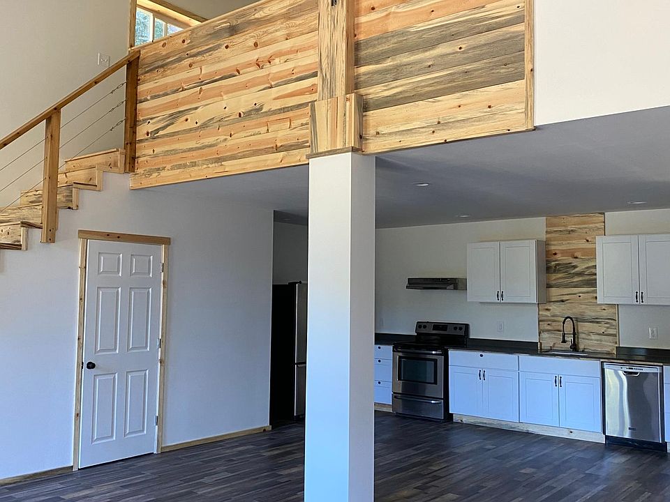 Vaulted open downstairs living and dining room.