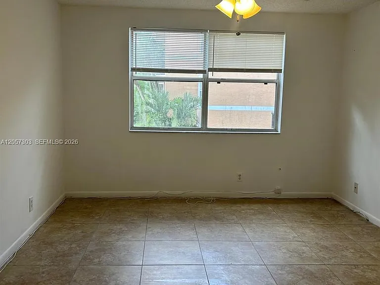 8851 Wiles Rd #208 — Photo 10