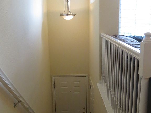 Stairs Down to Front Door From Family Room