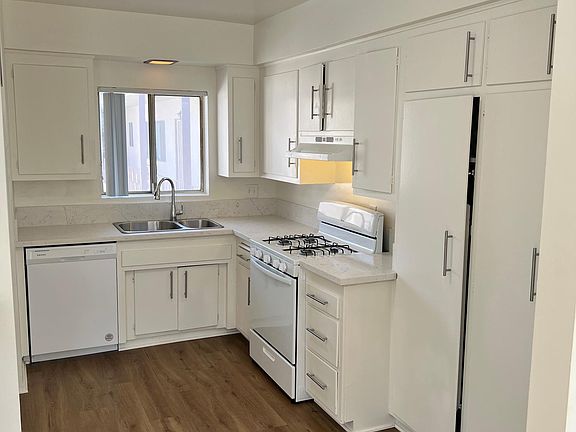 kitchen with granite counter tops and new appliances