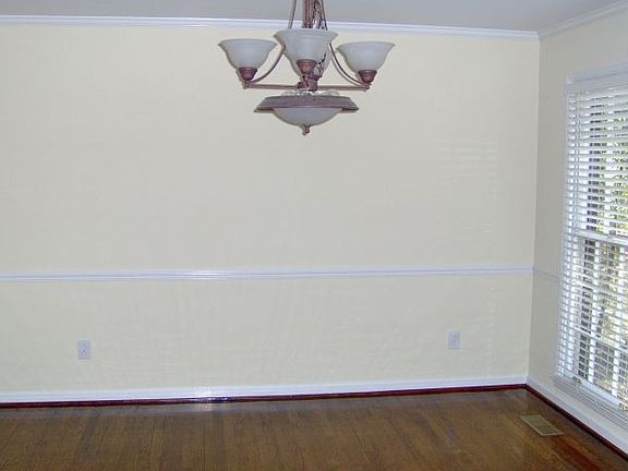 Lovely formal dining room with gleaming hardwood floors