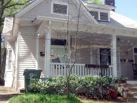 Front porch & drive on left to rear private parking...