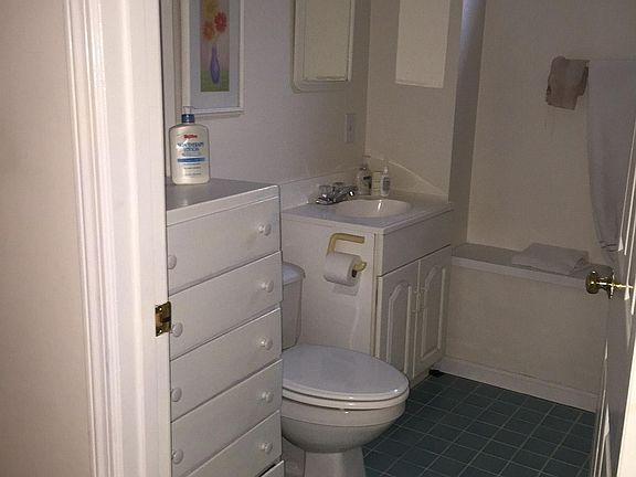 Bath with shower and tile floor