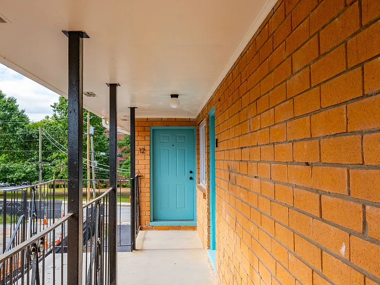 Exterior entrance and balcony overlooking the Beltline and soon-to-open Enota Park