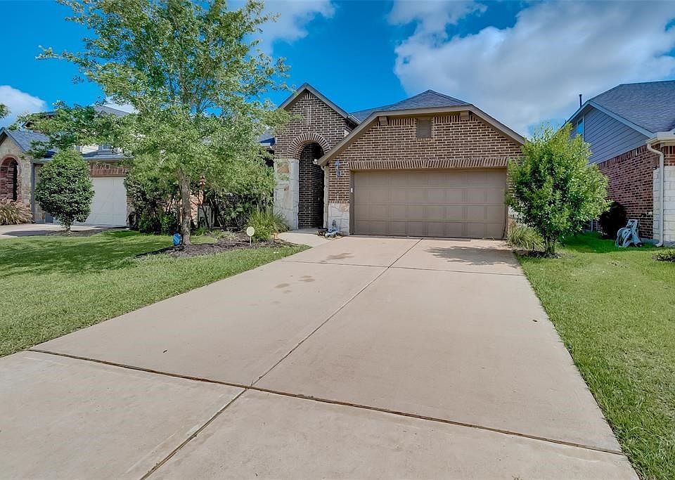 Front of the House with wide drive-way