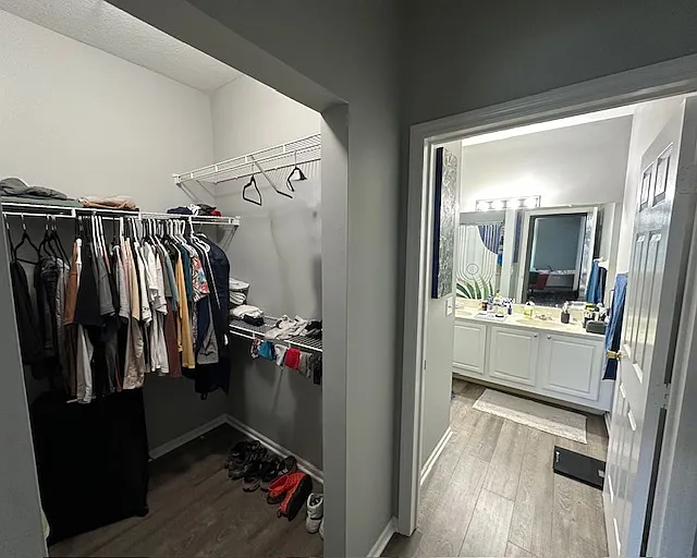 Primary bedroom with walk-in closet and private full bath.