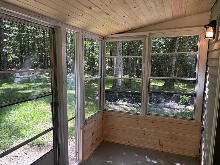 New shiplap on screened-in back porch.