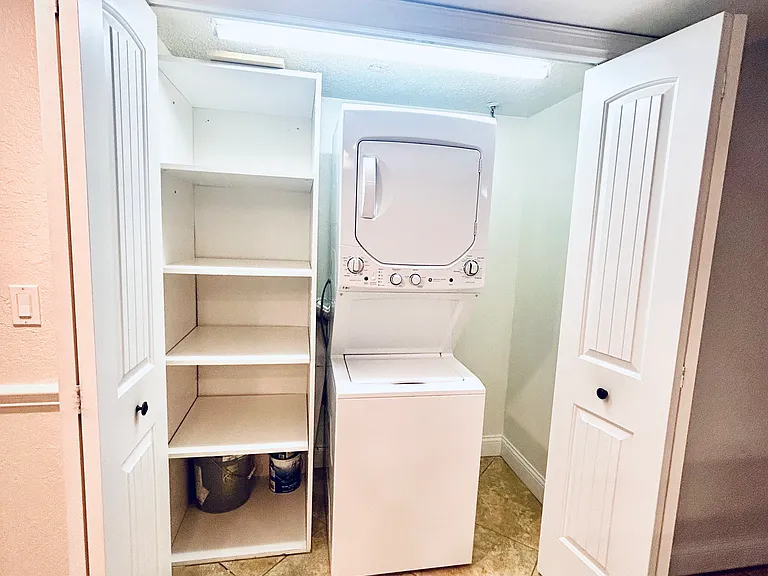 Washer dryer area with extra closet space