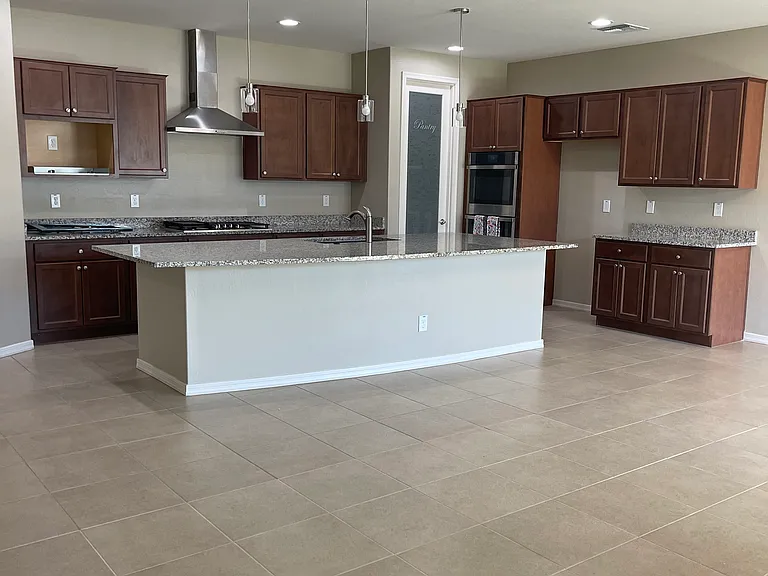 Open concept kitchen, dining and living area.