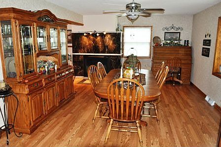 Dining Room - plenty of room for family meals and a nice view out the bay window -- and the fireplac
