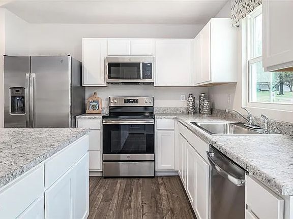 Model Kitchen. Actual Comes with the stainless steel appliances (Refrigerator, Electric Stove, Microwave, Owen)