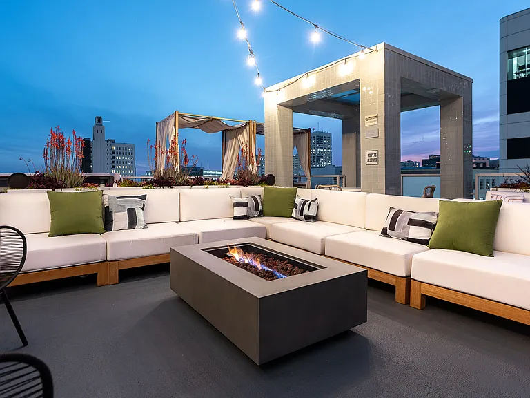 Elevated Elegance: Riva's Rooftop Lounge Area and Fire Feature