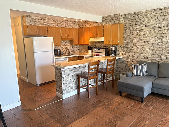 The living space includes the sofa (unless you want to change it out) and a wood burning fireplace for cozy evenings.