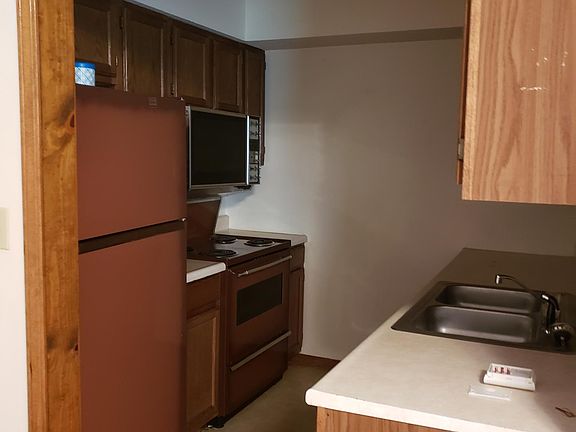 Kitchen showing the refrigerator and stove with double oven.
