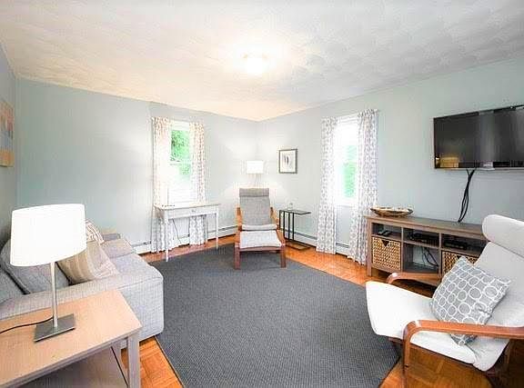 New living room with parquet floors and newish stylish furnishings