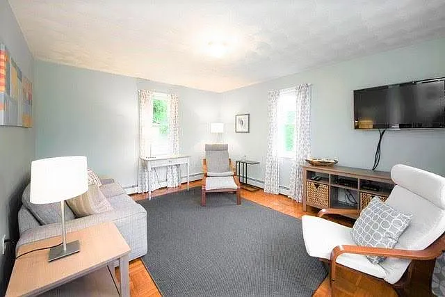 New living room with parquet floors and newish stylish furnishings