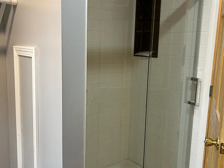 Tiled walk in shower and niche
