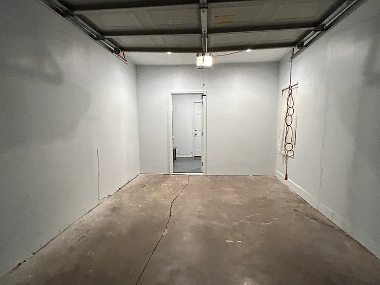Garage with an automatic garage door.