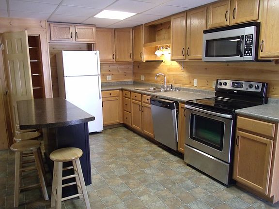 Full kitchen with dishwasher and pantry closet