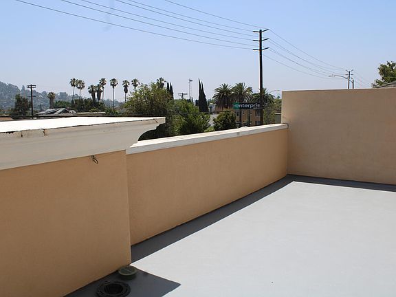 Large balcony with views of nearby hills