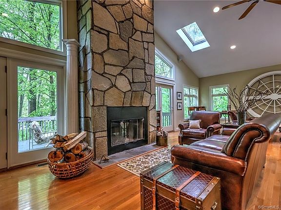 Custom windows, skylights and sliders to private deck frame the picturesque views making this the perfect room in every season!