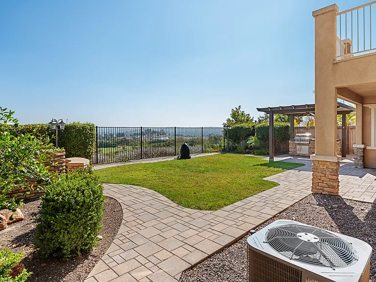 Professionally Landscaped backyard with Central Air, Firepit and BBQ Island