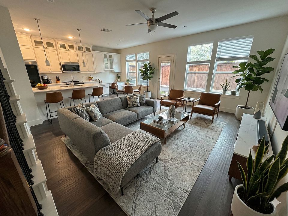Downstairs living room. Staged with Gemini 3.0