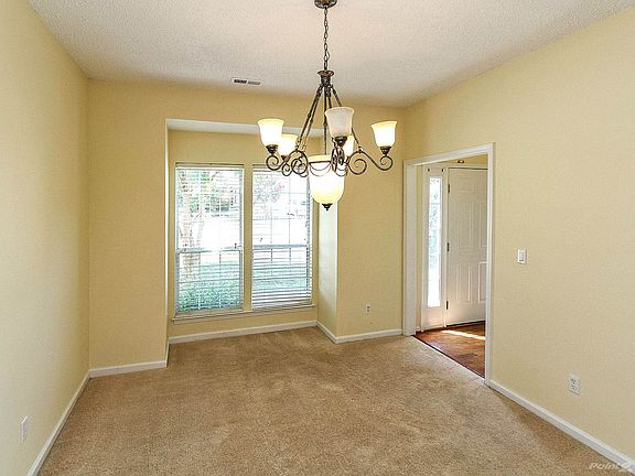 Bay window extensions brighten dining room and living room
