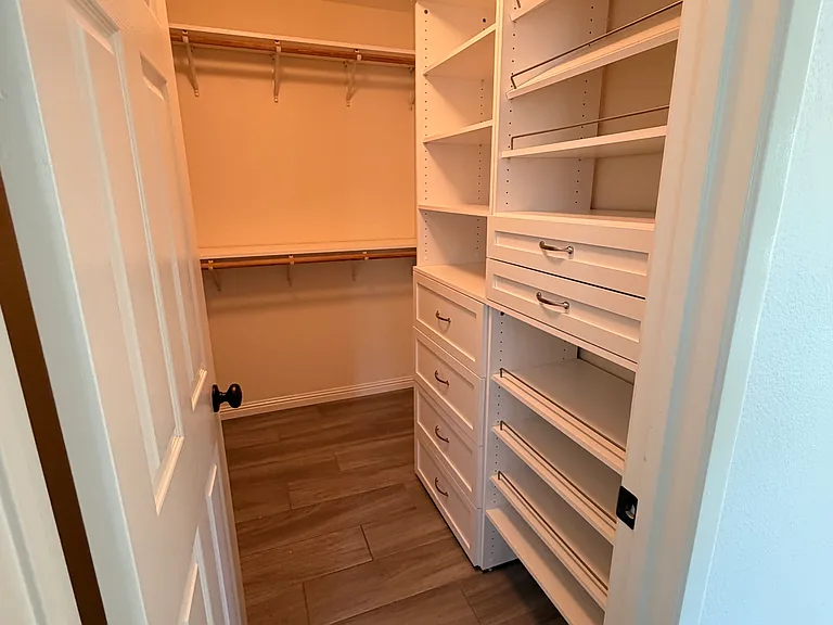 Primary walk-in closet.