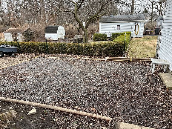 Sitting area behind garage 