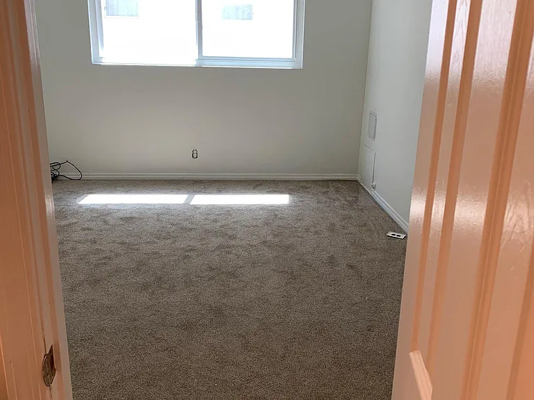 from jack / jill bathroom into largest bedroom #2 aprox 11x15