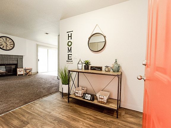 Lakewood Apartments - Crown Pointe Apartments - Entryway, Living Room, and Fireplace