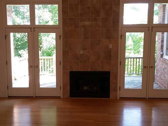 Upstairs open family room with fireplace, hardwood floors