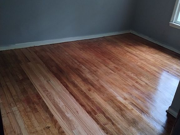 Touched up the white trim around the windows and the baseboards after this photograph was taken. But it has a full size closet in this room and one window.
