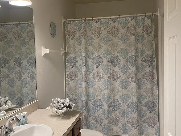Guest bath with stackable washer/dryer