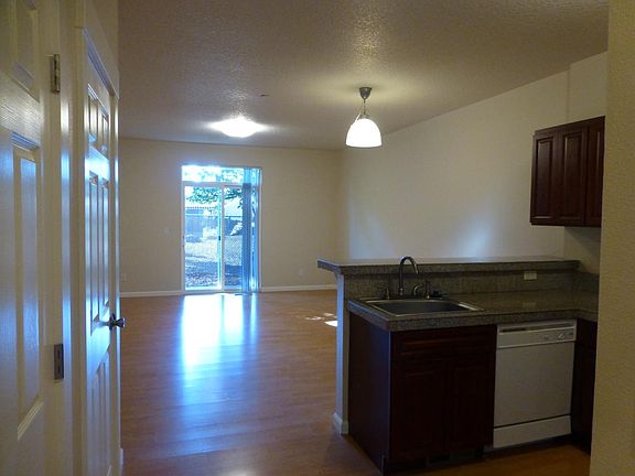 Kitchen looking into living room