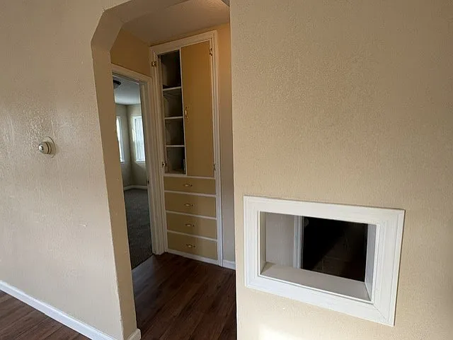 Hallway to two bedrooms and one bathroom