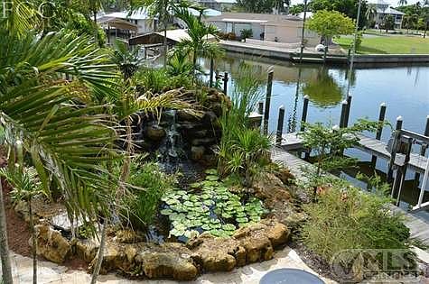 View of custom coral waterfall in the back yard.