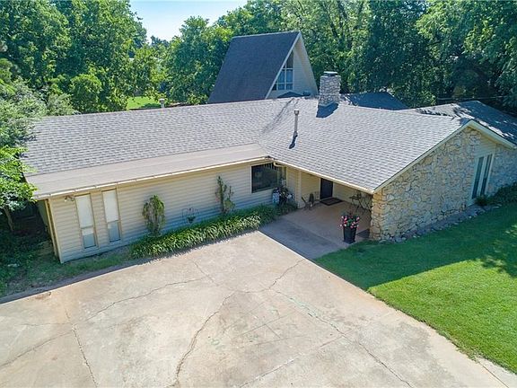 The A-frame portion of the home has a lovely bedroom, closet, and sitting area at the stair landing.