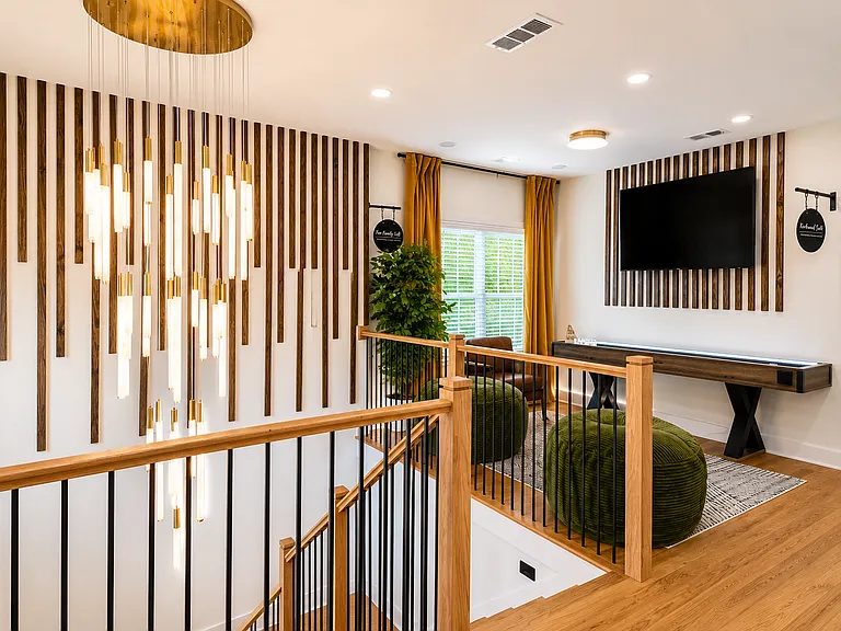 Step up the designer staircase into the vibrant loft and game room!