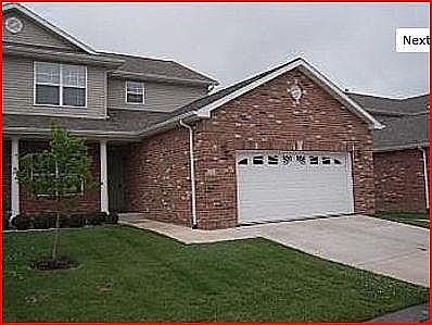 End unit with large 2 car garage