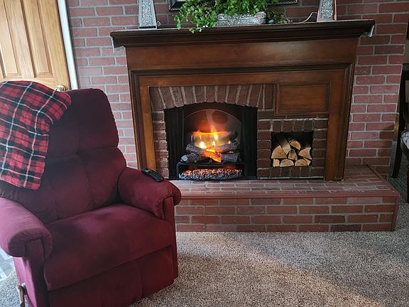 The living room offers an electric fireplace for ambiance and extra heat if needed.